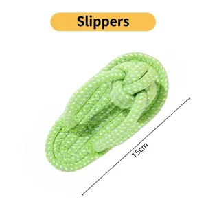 Detail view of 15cm green woven flip flops for dogs or kids on a plain white background