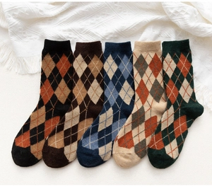 Detail showing five pairs of thick argyle wool blend socks in vintage earthy colors