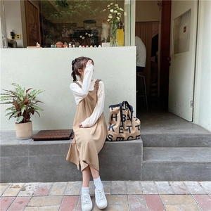 Detail of Korean style oversized canvas tote bag with logo paired with casual autumn outfit