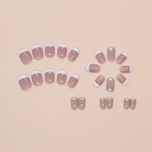 French style nude pink press-on nails with white tips and silver glitter accents