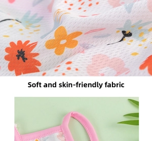 Detail of soft breathable mesh fabric with floral print and pink trim for pet vest