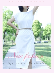 Close-up of slim brown PU leather belt with gold buckle on a white summer dress