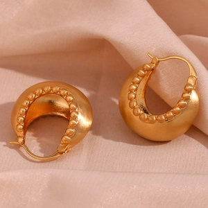 Detail of 18K gold-plated chunky hoop earrings with beaded inner rim on pink satin
