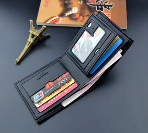 Interior detail of men's slim plaid wallet with multiple card slots and clear ID window