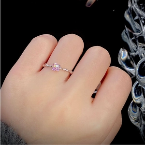 Pink square-cut gemstone ring with silver bamboo texture band shown on a hand