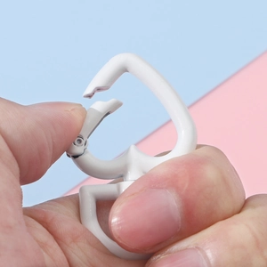 White heart-shaped metal spring buckle for DIY keychains showing opening mechanism details