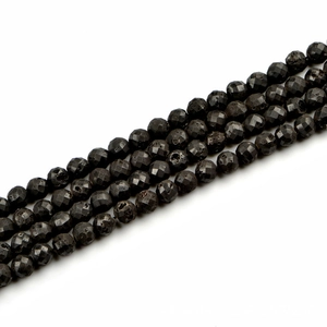 Faceted black lava stone round beads 10mm for jewelry making on white background