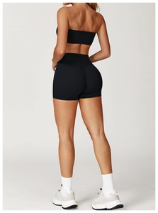 Rear view of black high-waisted yoga shorts showing lift and tight fit for women
