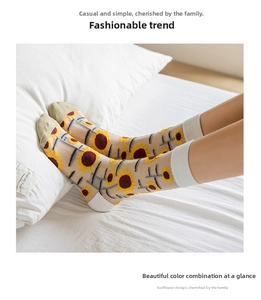 Detail of sheer mesh socks with sunflower embroidery shown in a bright cozy scene