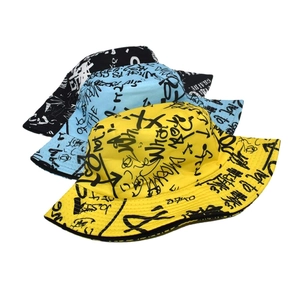 Graffiti print bucket hats in yellow, blue and black with trendy street style lettering