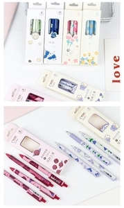 Detailed close-up of 0.5mm retractable gel pens with floral patterns and packaging set