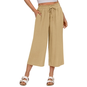 Detail view of elastic high waist with drawstring and side pocket on beige linen pants