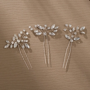 Silver U-shaped hairpin set with leaf design and sparkling rhinestones for bridal hairstyles