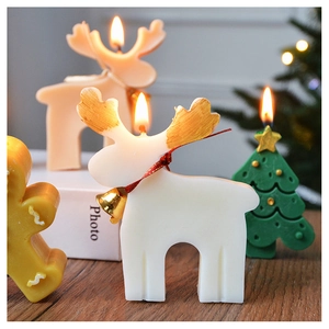 Festive scented candles featuring reindeer, Christmas tree, and gingerbread man shapes