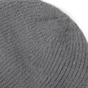Close-up of soft grey knit fabric showing premium plush texture and fuzzy material details