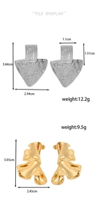Detail view of silver triangle and gold organic stud earrings with size and weight specs