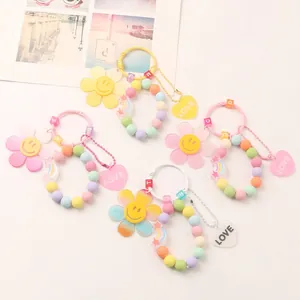 Colorful DIY flower beaded keychain with smile face sun charms and heart pendants