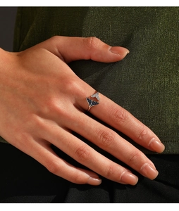 Detail of S925 silver mermaid tail ring featuring sparkling blue and white crystals