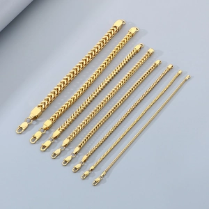 Detailed view of golden Franco chain bracelets in various widths and high-gloss finish