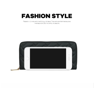 Detail of black quilted PU leather long wallet with gold zipper and phone storage capacity