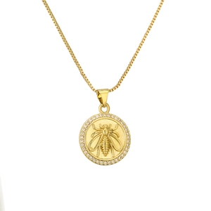 Elegant gold celestial necklace featuring a round zircon pendant with an embossed bee design