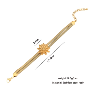 Detailed view of golden daisy charm on a double-layer snake chain with extension