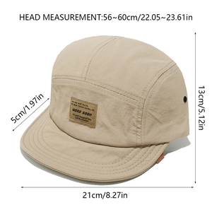 Detail view of khaki 5-panel camp cap with brand patch and dimension measurements