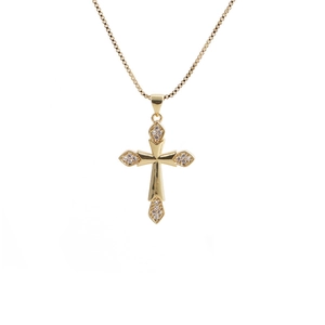 Detailed close-up of golden cross pendant with white zircon stones on a box chain
