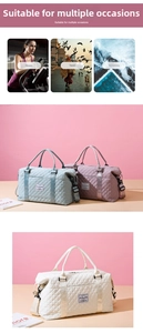 Detailed view of quilted travel bag with reinforced handles and adjustable shoulder strap