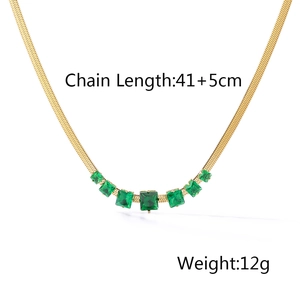 Detail of 18k gold plated flat snake chain featuring seven emerald square zircons