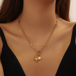 Gold chain necklace with starfish and pearl pendant, elegant accessory for women