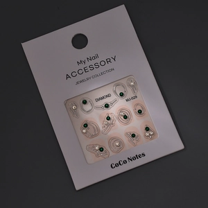Sparkling K9 rhinestones and silver metal geometric nail art accessories in MJ-029 packaging
