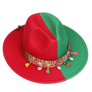 Detail of red and green wool fedora featuring colorful woven band and shell charms