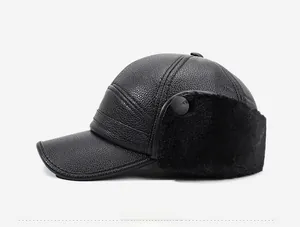 Detail view of winter leather baseball cap featuring warm faux fur ear flaps and stitching