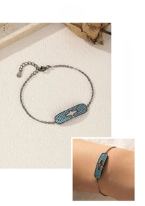 Detailed shot of S925 sterling silver vintage star bracelet with blue beads in black gunmetal