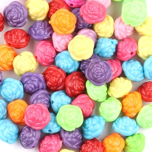 Macro shot of colorful rose shaped resin beads with precise holes for DIY jewelry