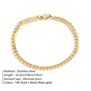 Detail view of a 14K gold plated stainless steel curb chain bracelet with a bar plate.