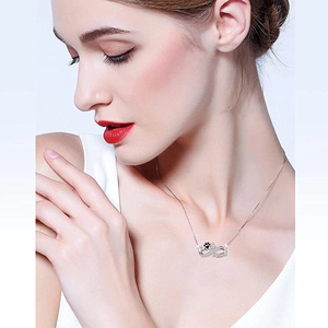 S925 sterling silver DOG MOM necklace with infinity symbol and paw print on model
