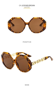 Detail view of leopard print octagonal sunglasses with golden Greek Key metal temples