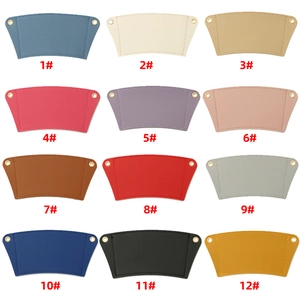 Detailed view of 12 multi-color PU leather coffee cup sleeves with stitching and gold eyelets