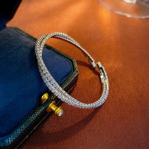 Detail of silver double-layered zircon bangle on a velvet box with a macro focus