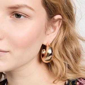 Polished oversized golden C-shaped crescent earrings for women in stainless steel