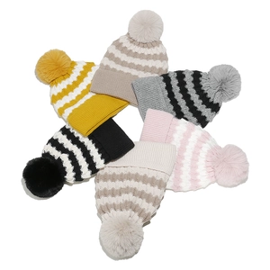 Striped knit beanie with faux fur pom pom in six assorted colors for outdoor winter wear