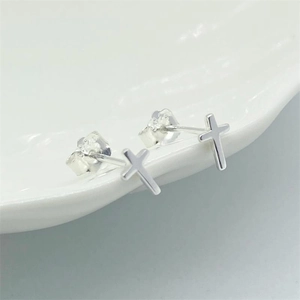 Pair of minimalist S925 sterling silver cross stud earrings with butterfly backs