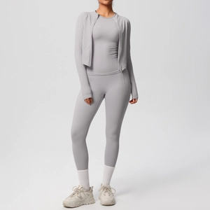 Detailed view of light gray three-piece yoga set including zip jacket and high waist pants