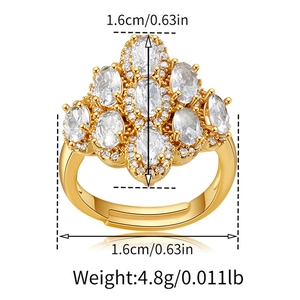 Detail view of gold zircon bow ring with dimensions 1.6cm and weight 4.8g markers