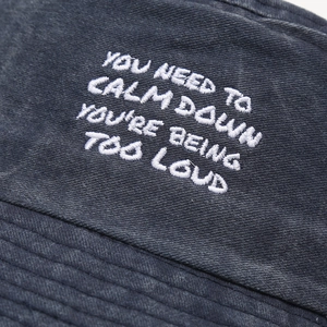 Deep grey washed canvas fishing hat with white embroidered slogan for outdoor sun protection