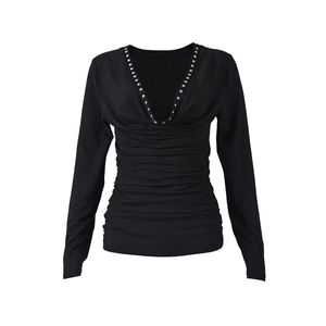 Detail of the deep V-neckline with silver metal rivets on this black ruched long sleeve top
