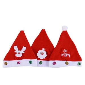 Close-up of three festive Christmas hats with 3D reindeer, Santa and snowman figures