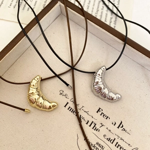 Minimalist croissant pendant necklace with black wax cord in gold and silver finish